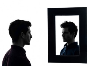 man in front of his mirror silhouette